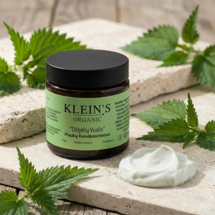 Klein's Organic jar with green label on a wooden surface with leaves