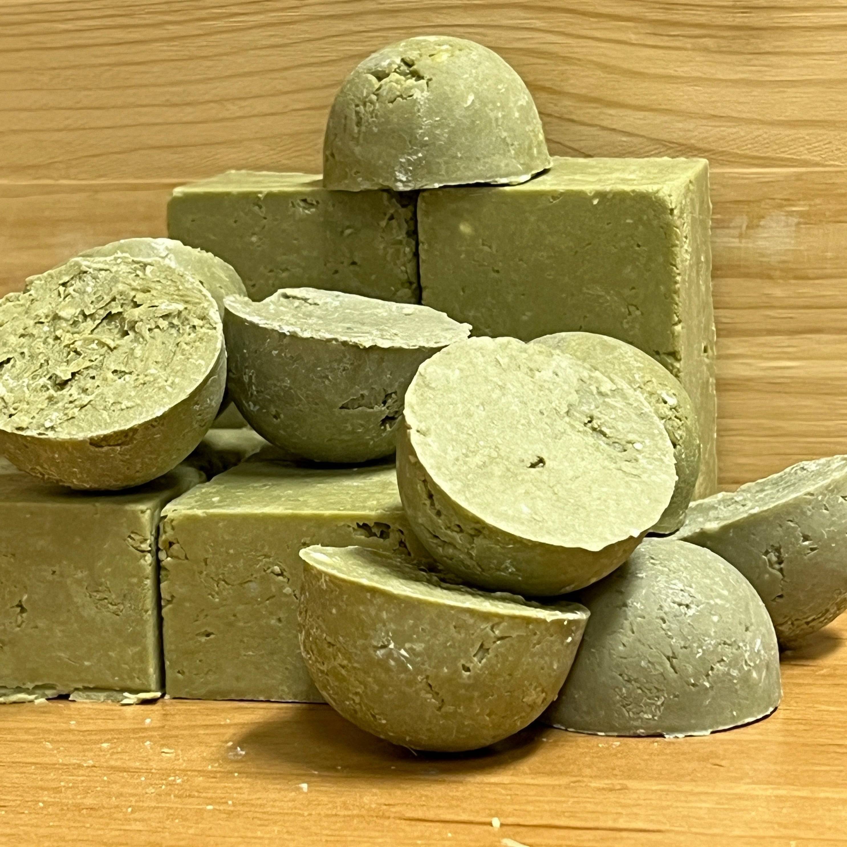 small green half circle samples of solid shampoo